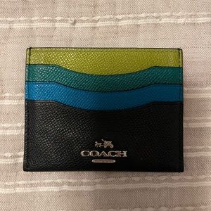 Coach multi colored card holder. 3 card slots. Leather. Silver emblem.